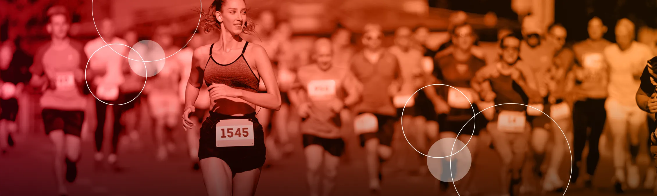 woman running on a marathon smiling